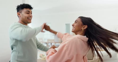 Dance, couple and celebrate moving to new home, real estate investment or freedom in apartment