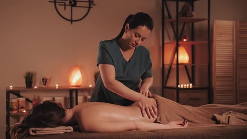 Master makes a professional massage, spa salon. Relaxing and healthing procedure.