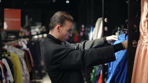 Professional Media Stocker Responsible for Organizing Fashion Items in the Store Space