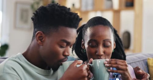Smiling Couple Enjoying Coffee Together at Home
