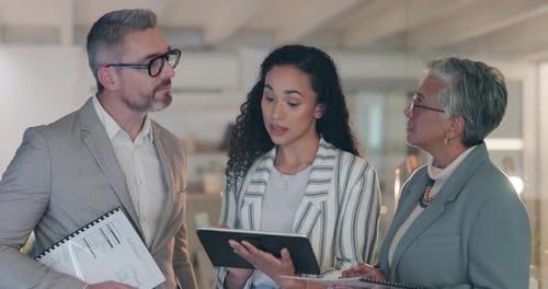Team Meeting with Tablet in a Modern Office
