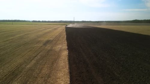 Tractors plowing the field in Ukraine