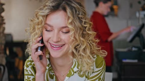 Pretty Lady Laughing Cellphone Enjoying Friendly Communication in Cafe Closeup