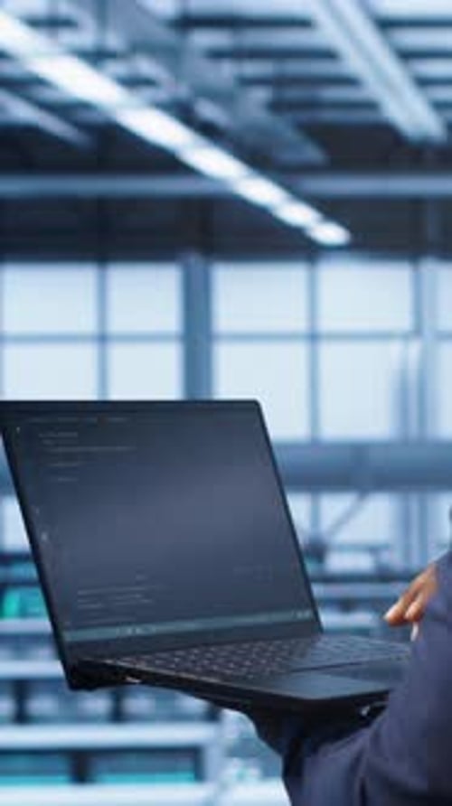 Vertical Video Admin in Data Center Running Error Checking Utilities on Tablet to Fix Hardware Bugs