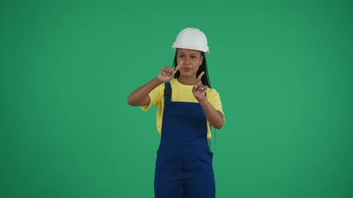 Medium Green Screen Isolated Chroma Key Video of a Darkskinned Young Female Construction Worker