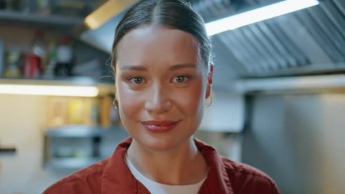Smiling Woman in Restaurant Kitchen Close Up