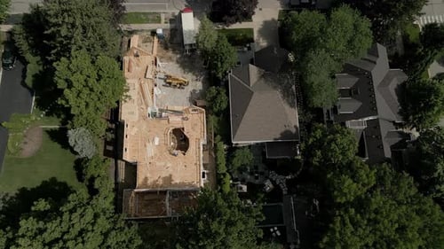 Aerial Drone Top Footage of Workers Building New Residential Home