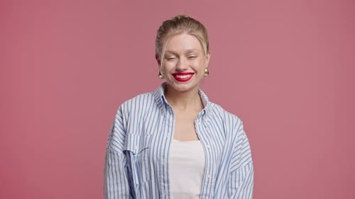 Smiling Woman with Red Lipstick Posing in Studio