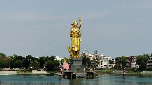 Golden Shiva statue at Sursagar Lake Vadodara Gujarat India - Spiritual heritage landmark