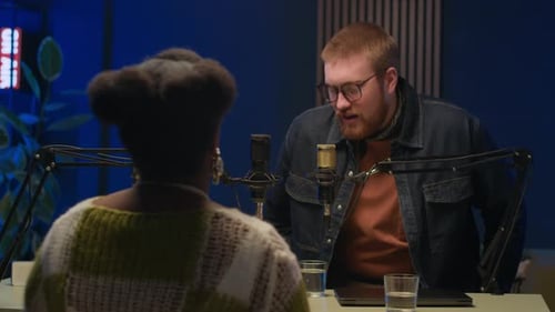 Young Diverse Podcast Host and Guest Returning from Break in Recording Studio
