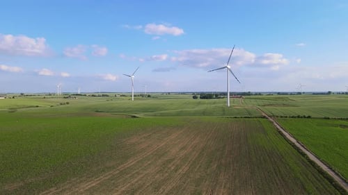Wind Generator Produces Clean Electrical Energy Wind Turbine Turning Amidst Expansive Agricultural