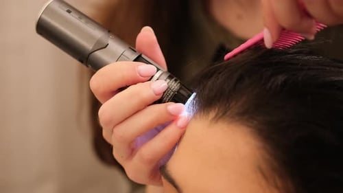 Trichologist Examining Patient's Hair and Scalp