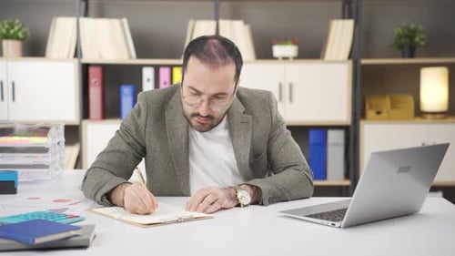 Stressed and worried Businessman working in office.