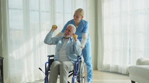 Senior Man Lifts Weights with Healthcare Worker Support