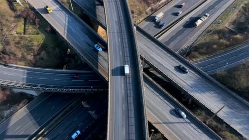 Time Lapse Vehicles Driving on a Highway Interchange Junction Aerial View