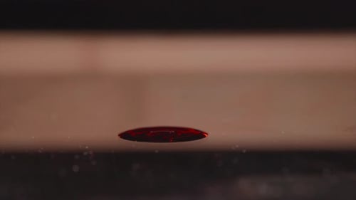 Thick Red Blood Dropping On Surface. close up, selective focus