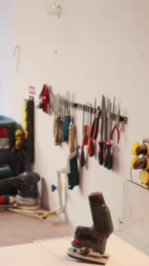 Vertical Video Close Up of Woodworking Gear on Rack in Joinery and Power Tool