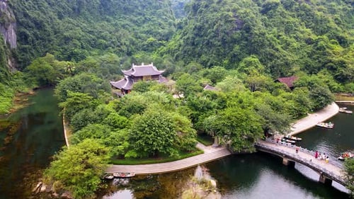 Aerial Of Trang An Temple Complex Located At Foothills Of Forested Limestone Cliffs In Ninh binh, Vi
