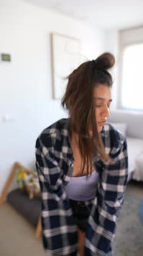 Woman Dancing Barefoot in Modern Apartment