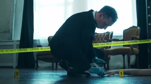 Man Investigates Crime Scene With Magnifying Glass