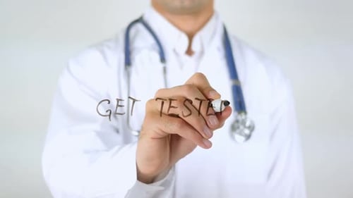 Get Tested Doctor Writing on Glass