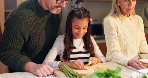 Family Prepares Food Together in the Kitchen