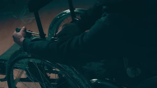 A Disabled Man Assembles a Stroller