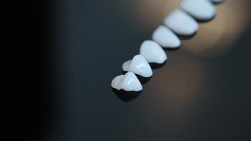 Dental Veneers for Perfect Smile on Dark Surface