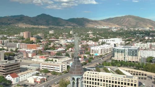 INCREIBLE SHOT ORBIT AROUND STATUE ON TOP OF SALT LAKE CITY AND COUNTY BUILDING
