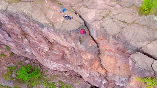 Rock Climbers On Steep Rocky Cliff, Aerial Drone Shot 4k