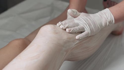Professional Body Waxing Procedure at a Wellness Center