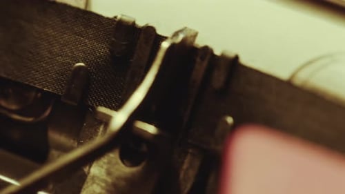 Analog Typewriter Printing Word Stop with Exclamation Marks on Paper