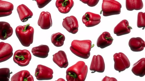 Floating Red Bell Peppers on White Background