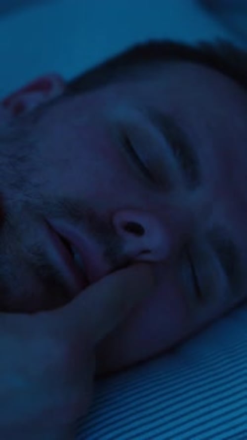 Man Sleeping with Breathing Problems and Blocked Nose