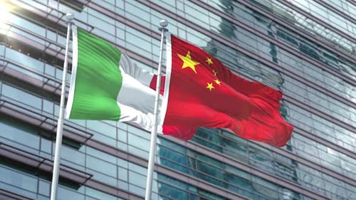 Italy and China Flags Waving Against Corporate Building