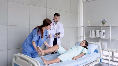 Patient Receives Physical Therapy in Hospital