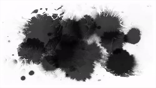 Expanding Black Ink Blots on White Surface