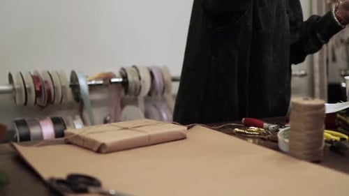 Present Wrapping with Ribbon in Workshop