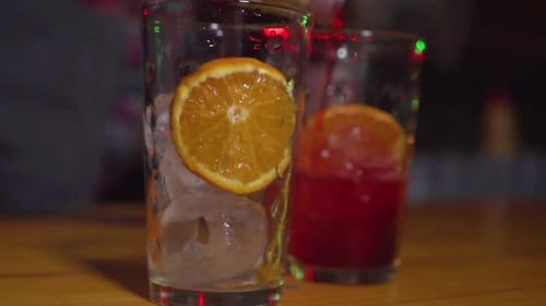 Barman Preparing a Drink on the Bar of a Nightclub, zoom out Slowmo
