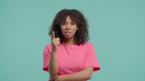 Woman Has an Idea and Points Upward, Thinking