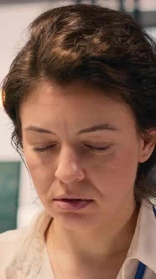 Vertical Video Anxious Businesswoman Under Intense Work Pressure at Office Desk