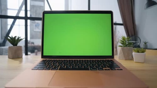 Modern Green Screen Laptop Placed on Empty Office Table Closeup Mockup Computer