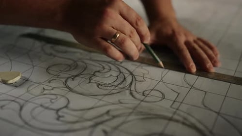 Unknown craftsman preparing wooden pattern design in carpentry workshop slow motion