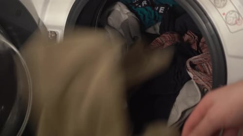Taking Clothes Out of Washing Machine