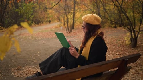 Artist Sketching in Serene Forest Side View in Autumn