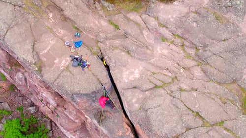 Rock Climbers on Steep Rocky Cliff, Aerial Drone