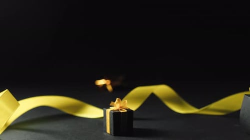 Elegant Gift Boxes with Golden Ribbon Background