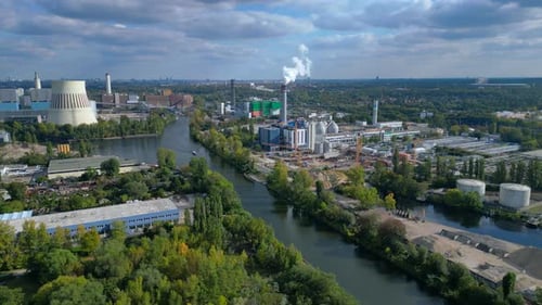 Berlin industrial area with power plant and river. Majestic aerial view flight drone