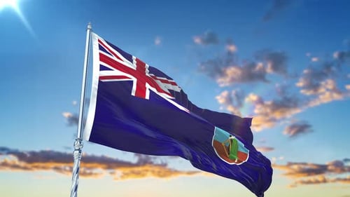 Waving Montserrat Flag Against Blue Sky with Sun Flare