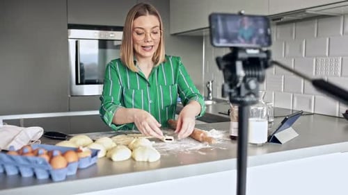 Woman Preparing Dough for Baking in Home Kitchen